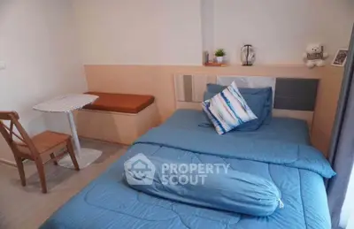 Cozy bedroom with modern decor and comfortable bedding in a stylish apartment.