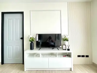 Modern living room with sleek TV stand and minimalist decor