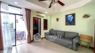 Spacious living room with balcony access and modern decor