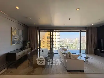 Luxurious living room with stunning city view, elegant furniture, and floor-to-ceiling windows.