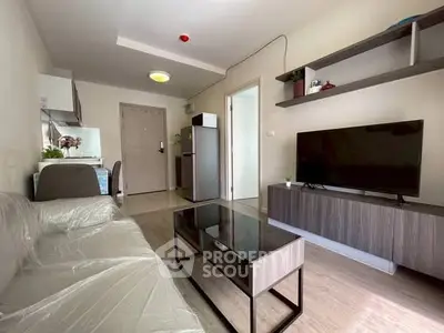 Modern living room with sleek furniture and open kitchen layout