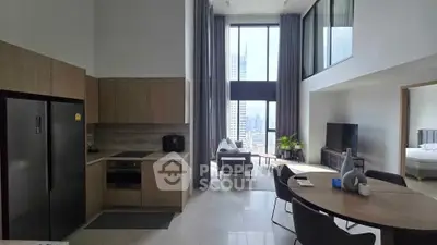 Luxurious open-plan living room with modern kitchen and stunning city view