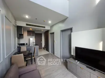 Modern living room with open kitchen and high ceiling in stylish apartment