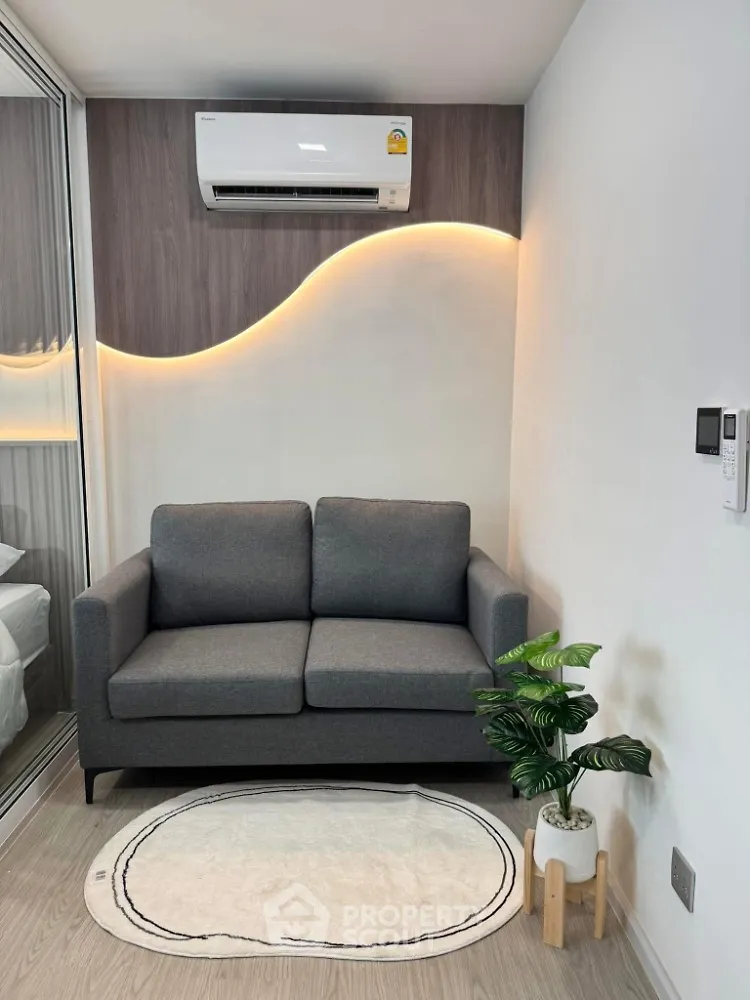 Modern living room with stylish sofa and ambient lighting