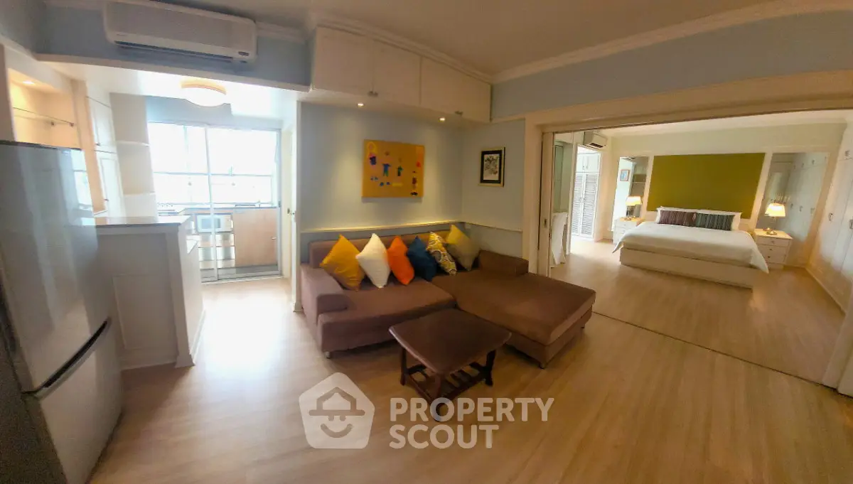 Spacious open-plan living room with cozy seating and modern decor