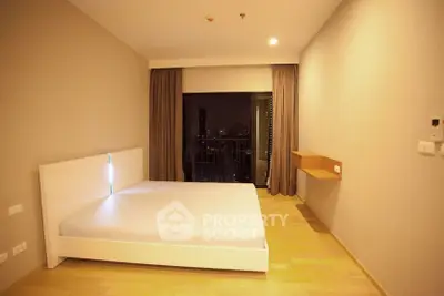 Spacious bedroom with city view and modern minimalist design