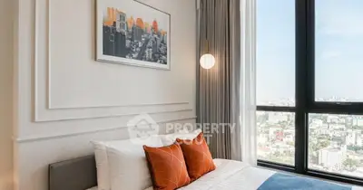 Modern bedroom with large window offering stunning city view and stylish decor.