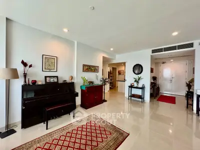 Spacious living room with elegant decor and piano, featuring polished floors and modern lighting.