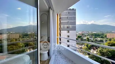 Stunning balcony view with mountain backdrop and modern apartment interior.
