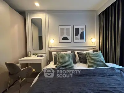 Modern bedroom with stylish decor and cozy ambiance, featuring elegant lighting and contemporary artwork.