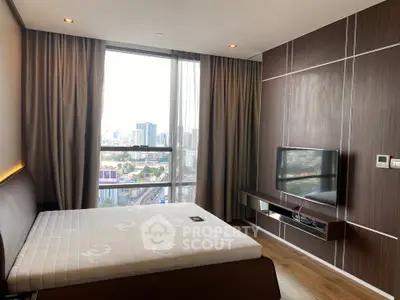 Modern bedroom with city view, featuring sleek wood paneling and large window for natural light.