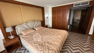 Luxurious bedroom with elegant wood finishes and stylish chevron flooring