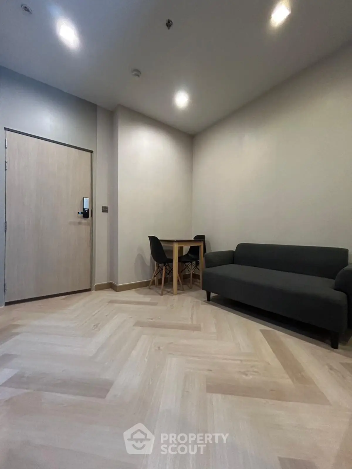 Modern minimalist living room with sleek furniture and wooden flooring