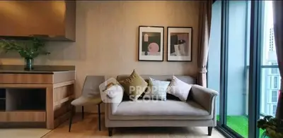 Modern living room with cozy sofa and balcony view