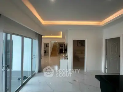 Luxurious open-plan living space with modern design and elegant lighting