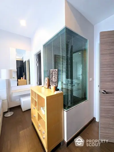 Modern interior with stylish decor and unique glass feature wall