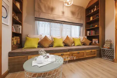 Cozy living room with built-in seating and stylish decor