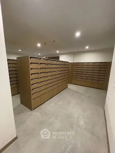 Spacious mailroom with organized wooden mailboxes in modern building