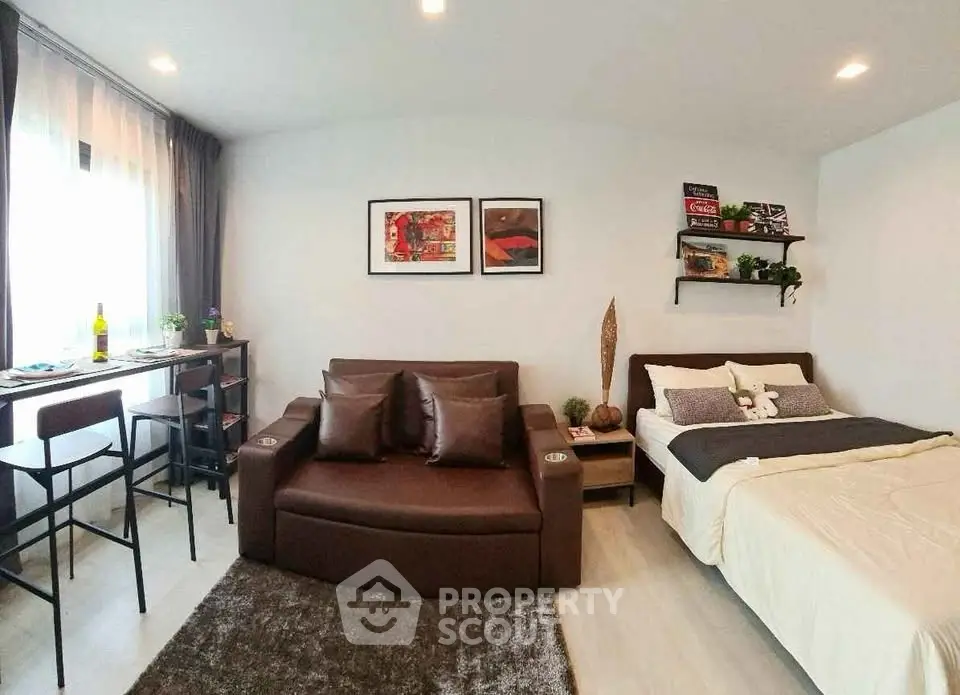 Modern studio apartment with cozy living area and stylish decor