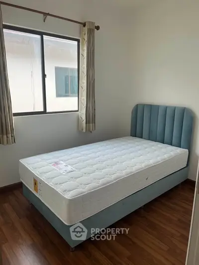 Cozy bedroom with elegant bed and natural light from window