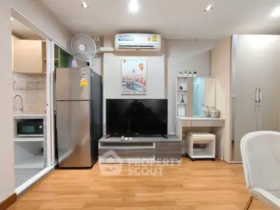 Modern living room with sleek furniture and open kitchen layout