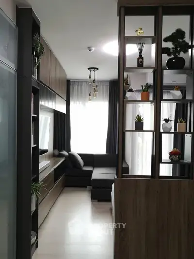 Modern living room with stylish shelving and cozy seating area, perfect for relaxation and entertainment.