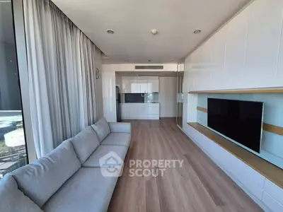 Modern living room with sleek design and large windows