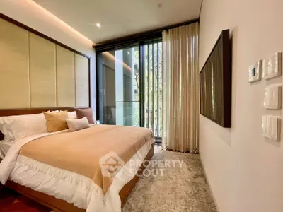 Luxurious bedroom with large window and elegant decor, perfect for relaxation and comfort.