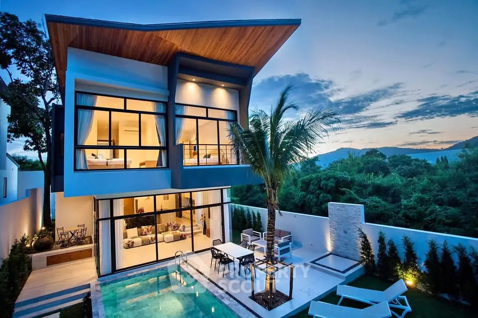 Stunning modern villa with pool and lush garden, perfect for luxury living.