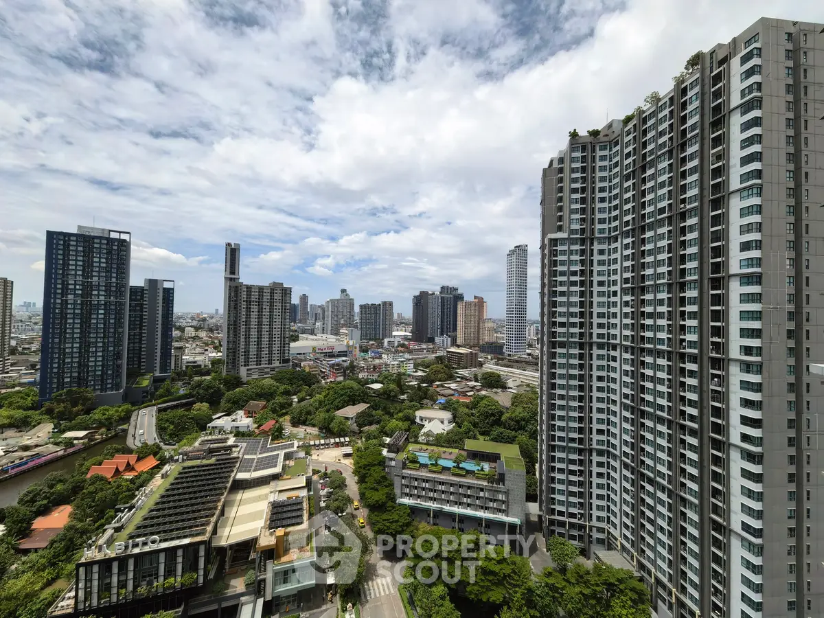 Stunning cityscape view with modern high-rise buildings and lush greenery, perfect for urban living.