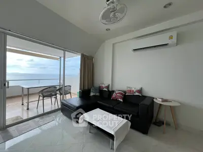 Modern living room with ocean view and spacious balcony
