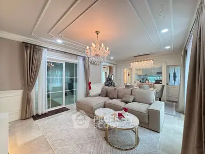 Luxurious living room with elegant chandelier and spacious seating area
