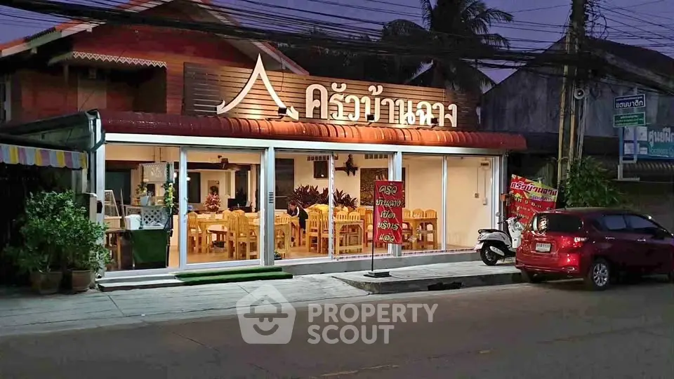 Charming restaurant exterior with inviting ambiance and warm lighting at dusk.