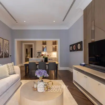 Luxurious open-plan living room with elegant decor and modern kitchen