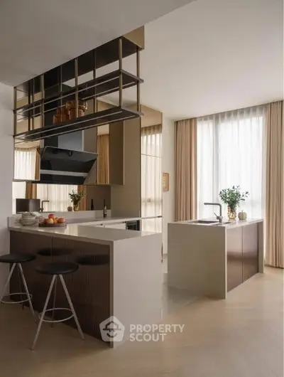 Modern kitchen with sleek design and open layout, featuring stylish bar stools and ample natural light.