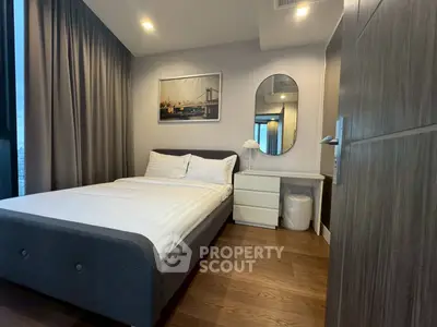 Modern bedroom with cozy bed and stylish decor in urban apartment