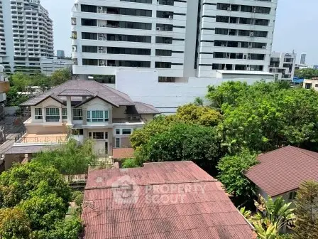 Stunning urban view with lush greenery and modern buildings, perfect for city living.