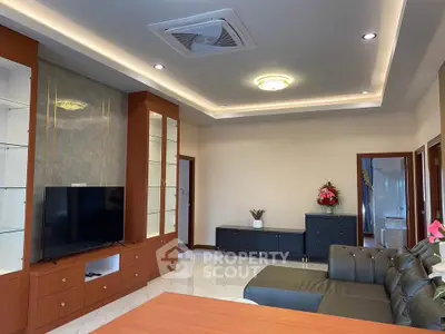 Spacious modern living room with sleek furniture and built-in shelving