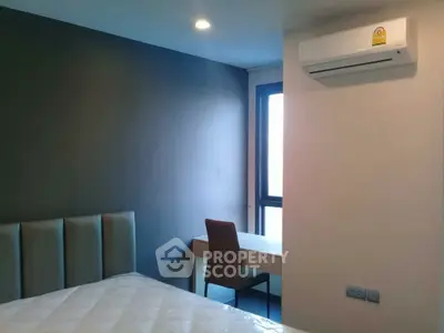 Modern bedroom with air conditioning and study desk, perfect for comfort and productivity.