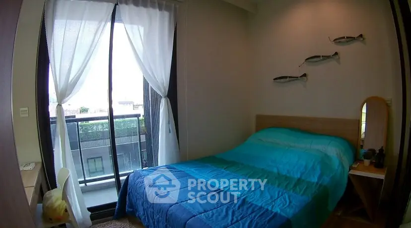 Cozy bedroom with balcony access and stylish decor