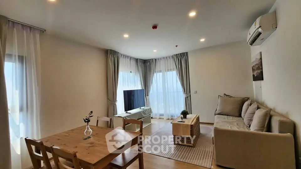 Spacious modern living room with natural light and stylish decor