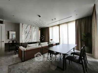 Luxurious modern living room with elegant dining area and floor-to-ceiling windows.