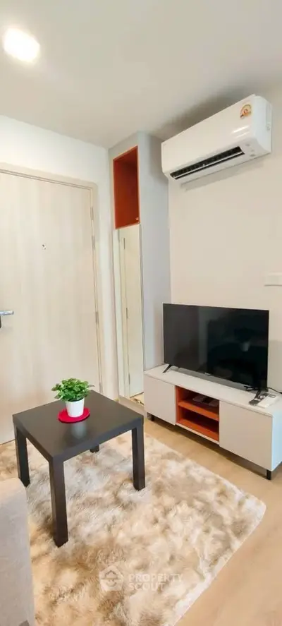 Modern living room with air conditioning and stylish decor