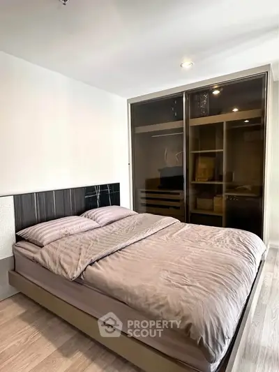Modern bedroom with sleek design and spacious wardrobe