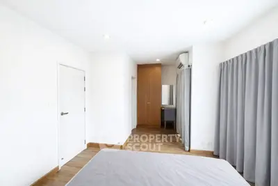 Spacious bedroom with modern design and ample natural light