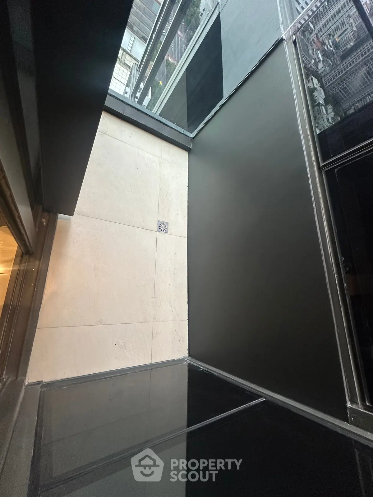 Modern building entrance with sleek glass and metal design