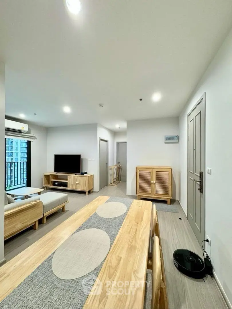 Modern living room with wooden furniture and sleek design in a bright apartment