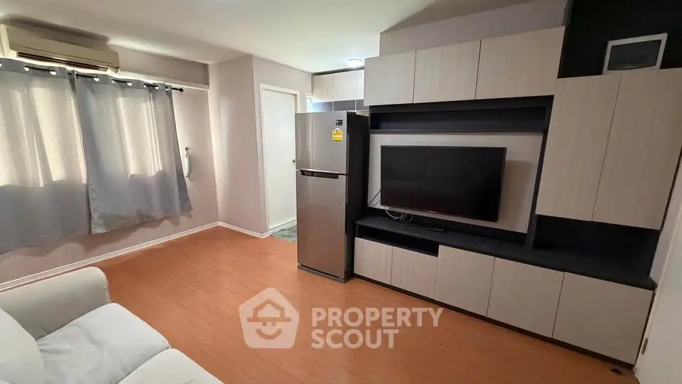 Modern living room with sleek entertainment center and cozy ambiance