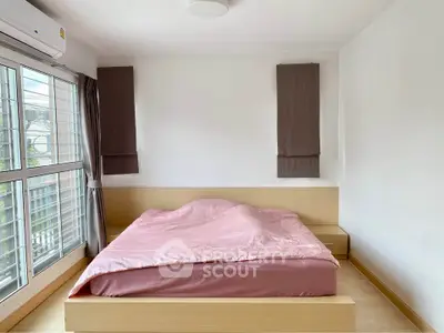 Bright bedroom with large windows and modern decor