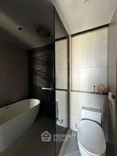 Luxurious modern bathroom with sleek design and elegant bathtub, perfect for relaxation.